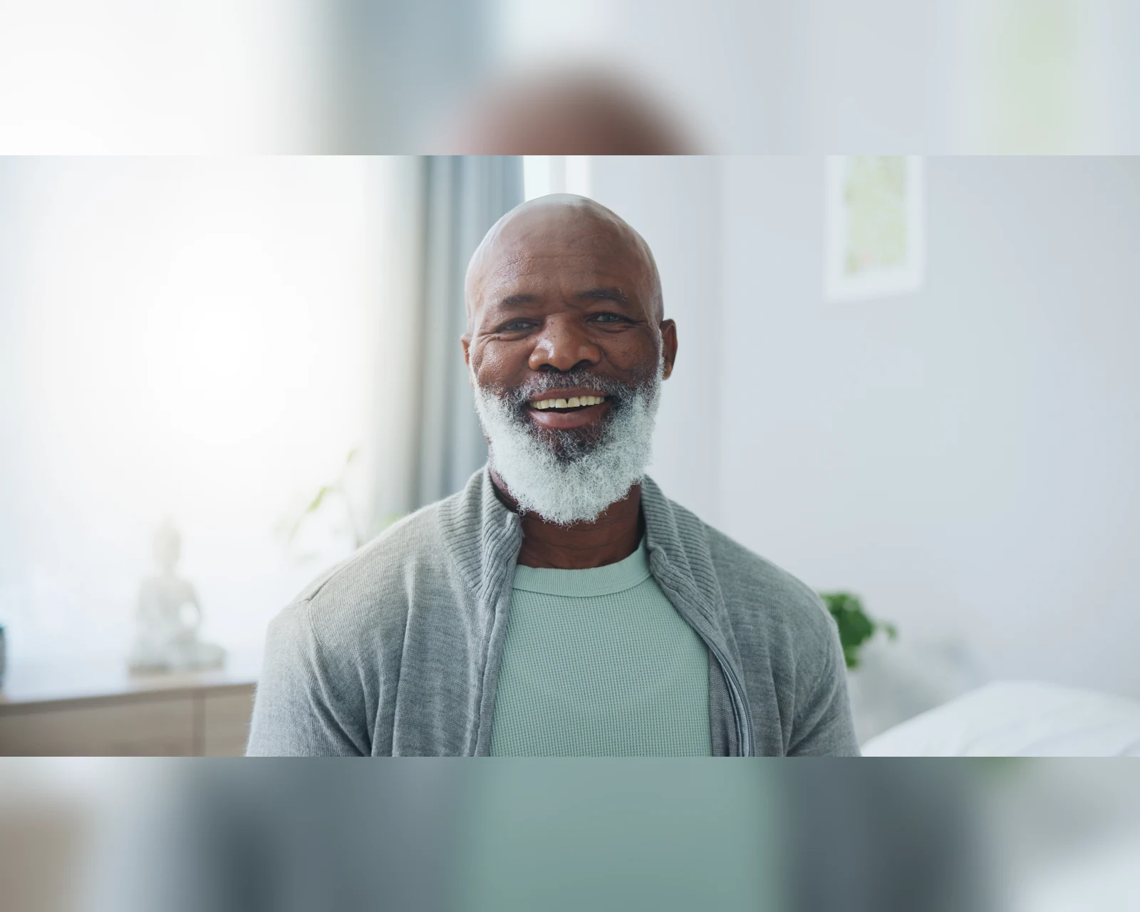 Smiling older man in soft natural light
