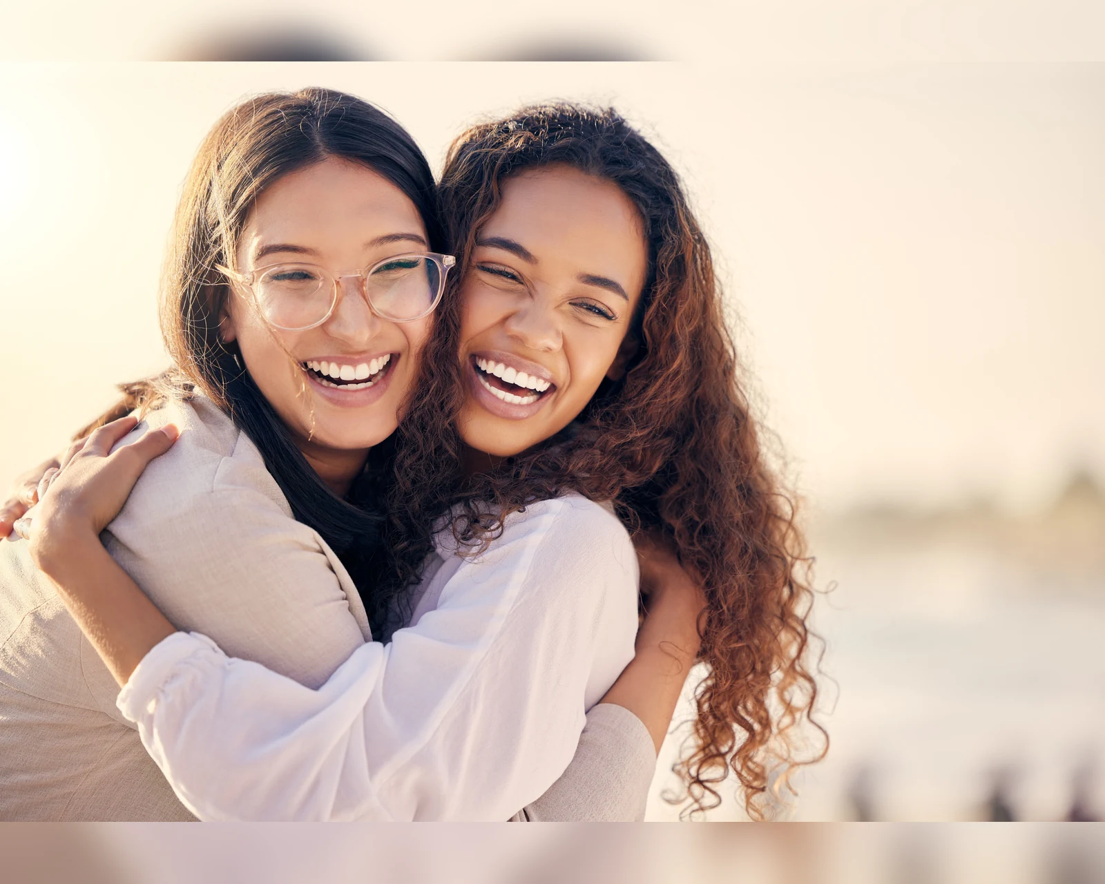 Two smiling friends outdoors